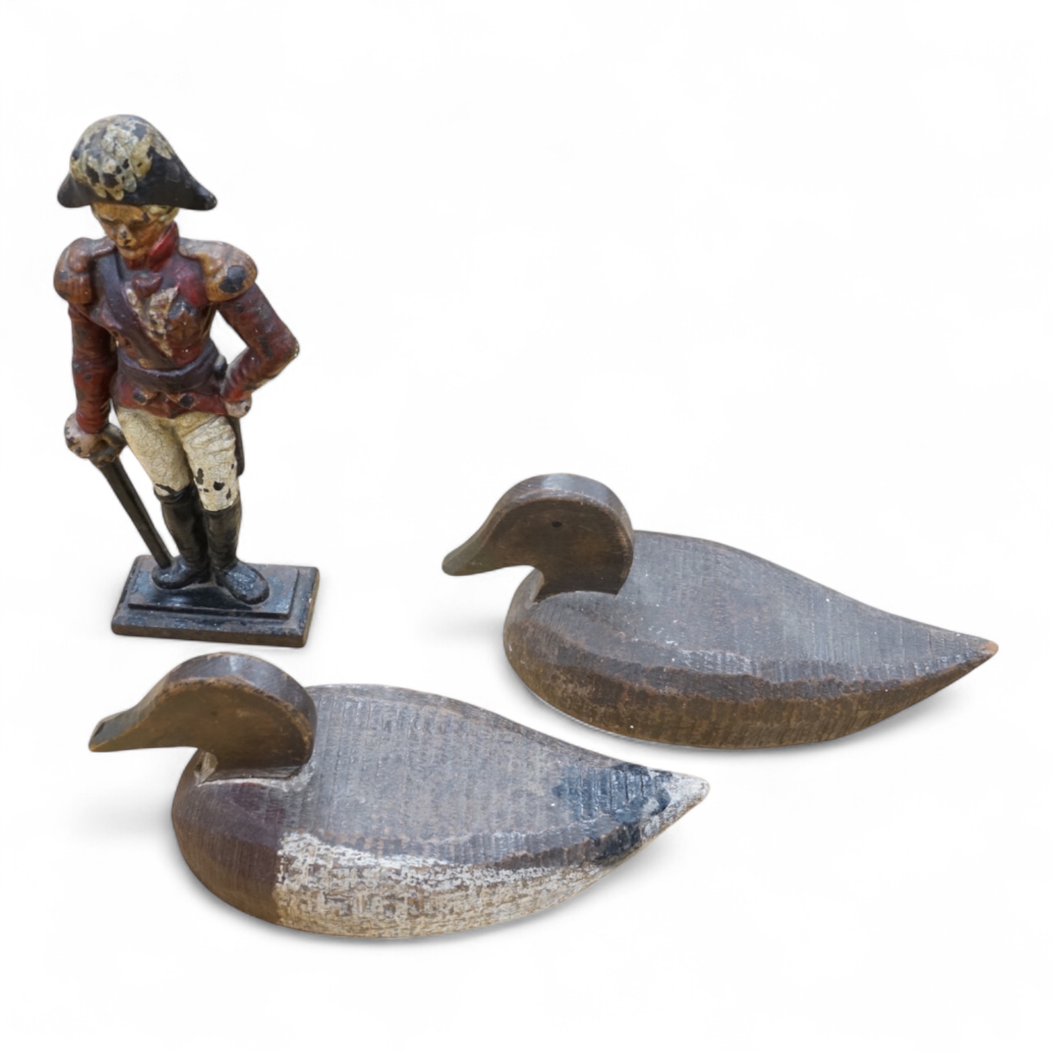 A cast iron ‘Admiral’ door-stop and two wooden decoy ducks, door stop 35cm high